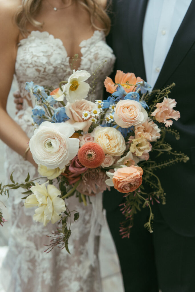 Whimsical blue and peach bridal bouquet